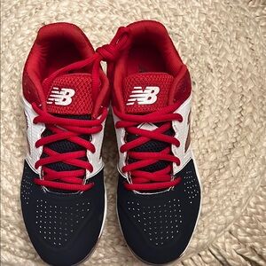 New Balance Red and Black  womens cleats size 5, new with box